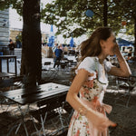 Rent a romantic Berwin & Wolff dirndl featuring delicate floral print bodice and matching pink skirt in Munich for Oktoberfest.