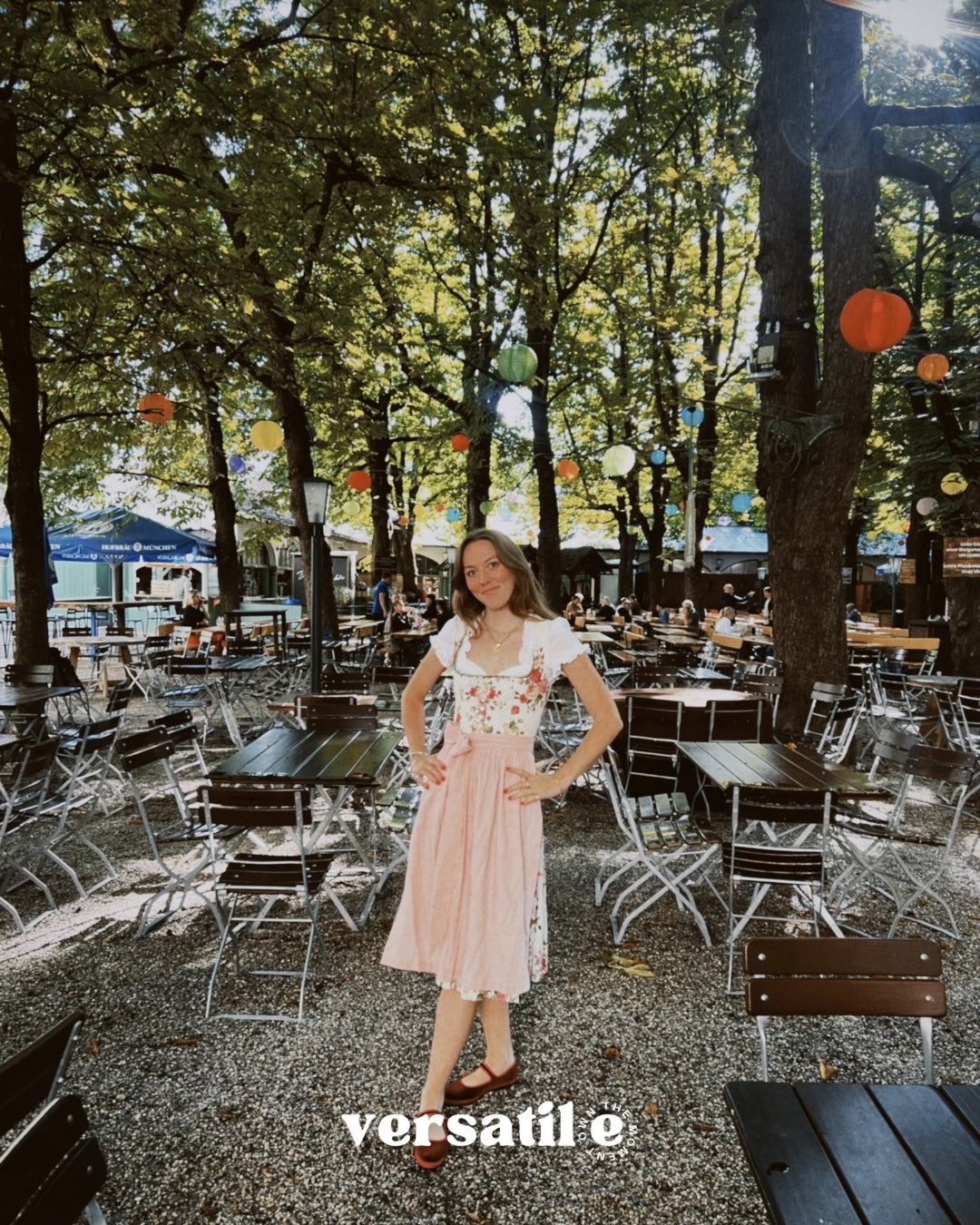 Munich Oktoberfest-ready: Berwin & Wolff dirndl rental with square neckline, floral bodice, button closure, and 70 cm pink cotton skirt.