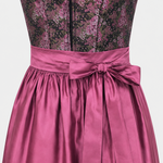Detail of Catherine Hummels Dirndl with pink rose pattern and lustrous pink apron bow