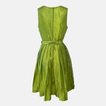 Lime-green Bavarian rental dirndl with colorful lace-up bodice and embroidered apron, available at Versatile OTM in Munich, owned by Beer&Pretzel Tours.