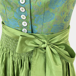 Detail of Hammerschmid floral bodice with white buttons, green apron bow and smocked waistband