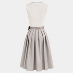Back view of Krüger gold Dirndl with cream bodice, taupe patterned skirt and matching waist sash