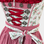 Detail of Krüger Madl floral bodice with bordeaux ribbon lacing, ornate silver-toned hooks and floral apron bow