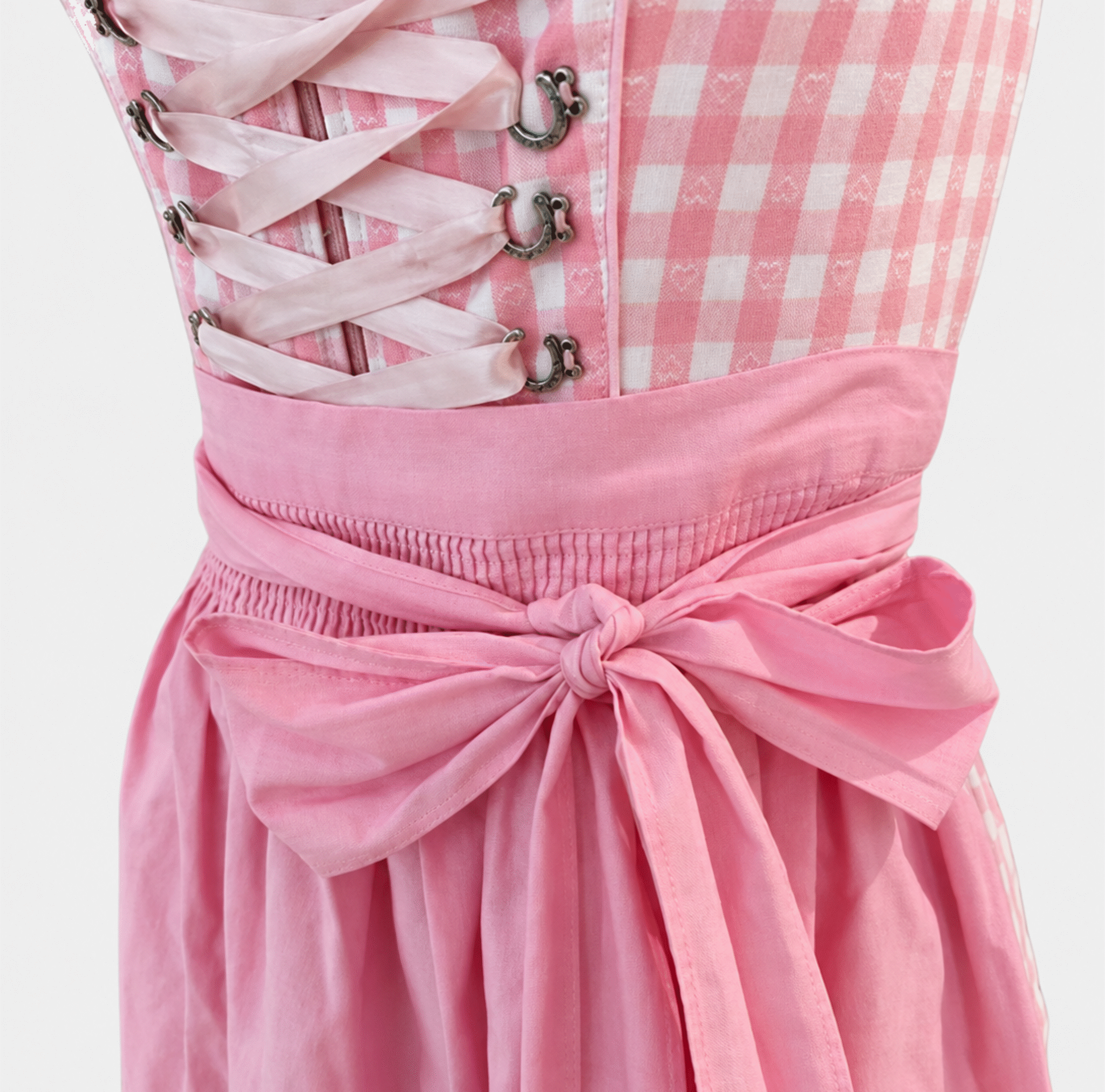 Detail of Krüger Manufaktur pink gingham Dirndl with ribbon lacing and pink apron bow