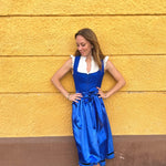 Munich Oktoberfest rental: Ma.Le.Ma crafted royal-blue dirndl with square neckline, silk skirt, satin bow apron, and playful dotted underskirt detail.