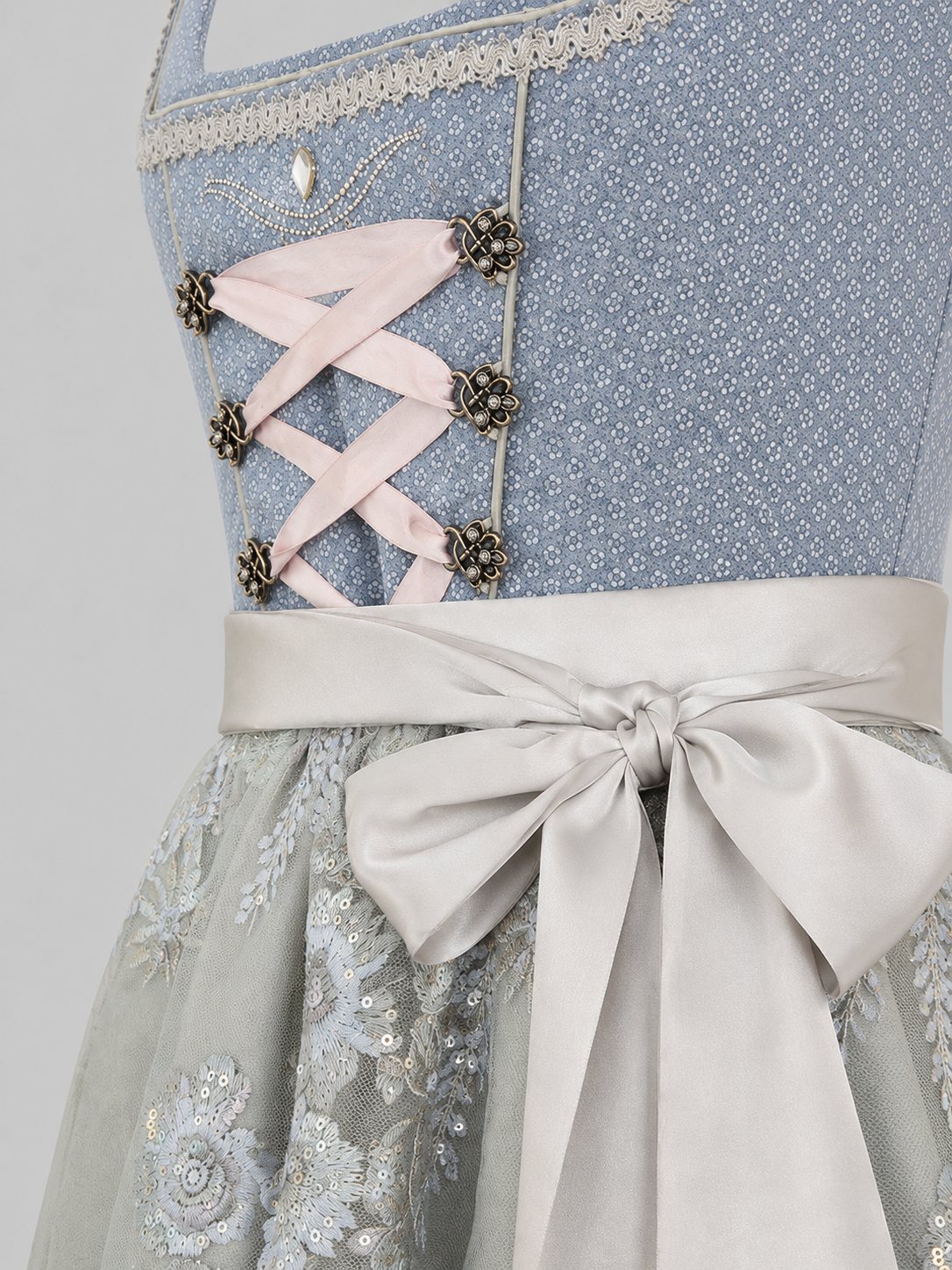 Close-up of the light blue MarJo Dirndl bodice, ribbon lacing and silver satin apron bow