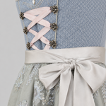 Close-up of the light blue MarJo Dirndl bodice, ribbon lacing and silver satin apron bow