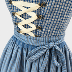 Detail of Redel blue checked bodice with cream ribbon lacing and striped apron bow