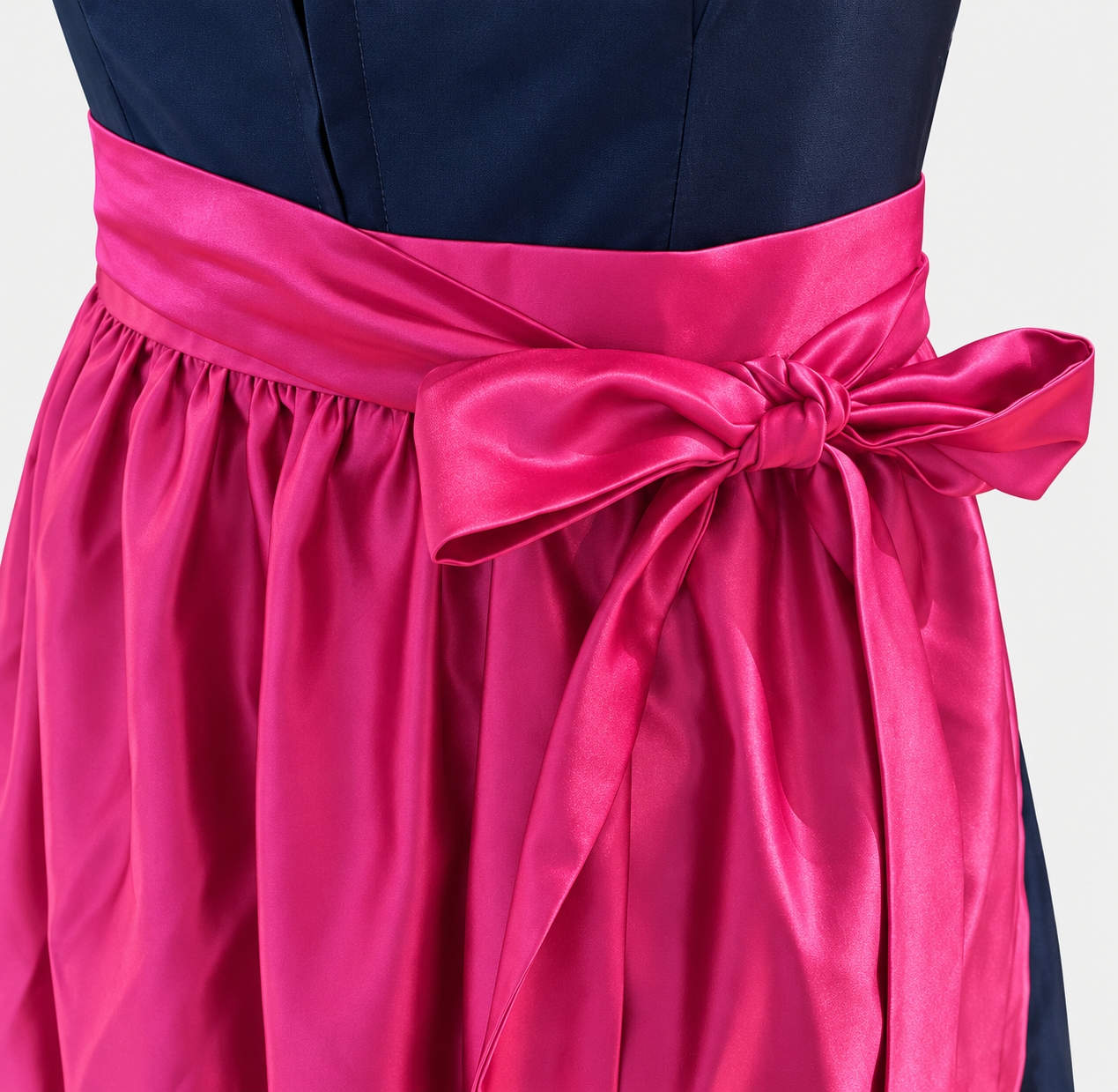 Detail of Versatile Collection Charlotte navy bodice and lustrous fuchsia apron bow
