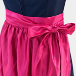 Detail of Versatile Collection Charlotte navy bodice and lustrous fuchsia apron bow