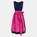 Front view of handmade Versatile Collection Charlotte navy Dirndl with fuchsia apron for rental in Munich
