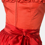 Handmade red Versatile Collection Dirndl with tone-in-tone bodice and apron – modern, elegant, and available to rent at Versatile OTM.
