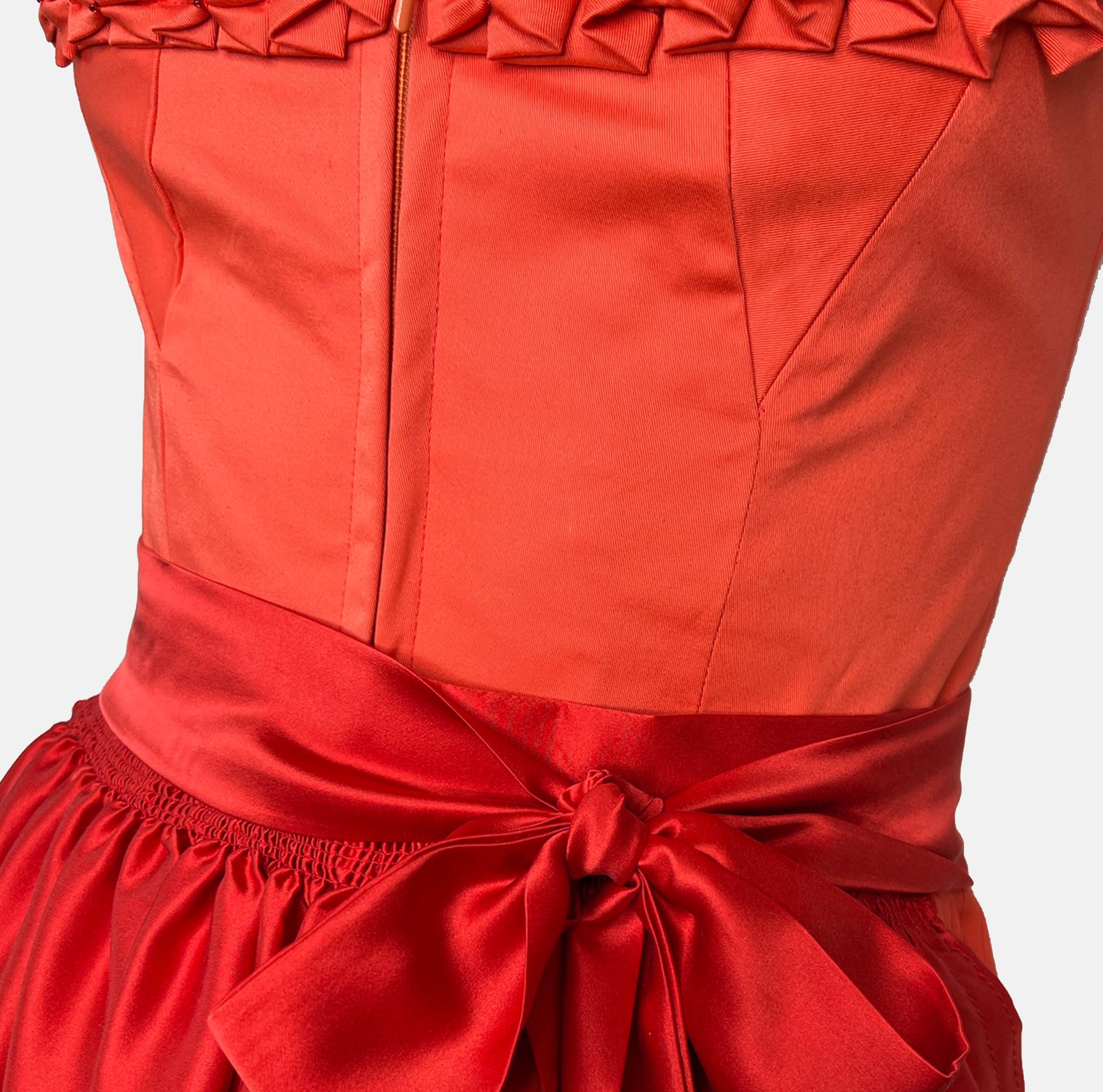 Handmade red Versatile Collection Dirndl with tone-in-tone bodice and apron – modern, elegant, and available to rent at Versatile OTM.